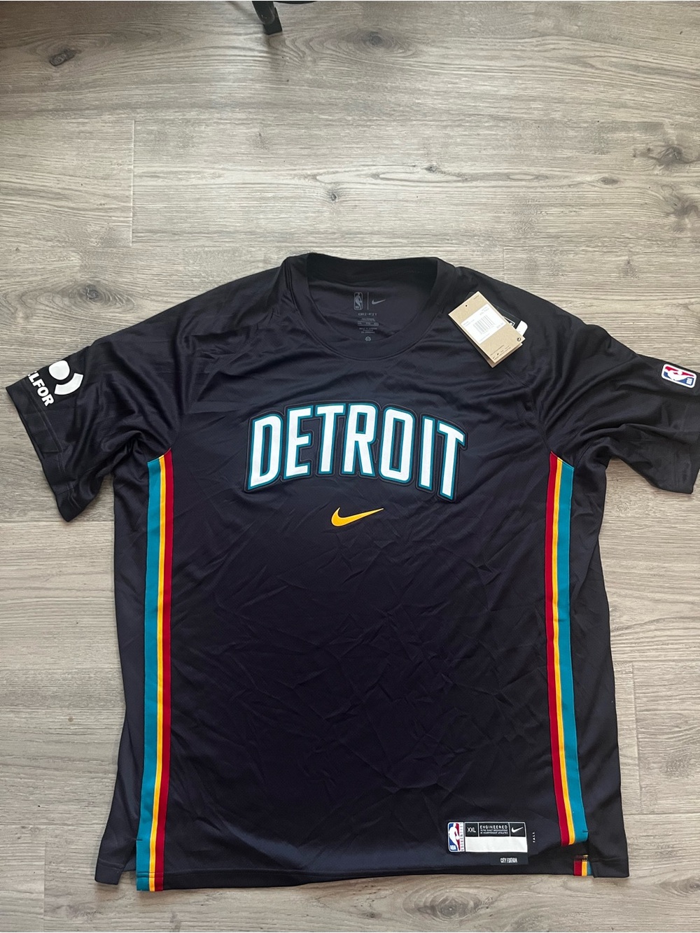 Nike Black Detroit Basketball Jersey with Teal, Red & Yellow Accents
